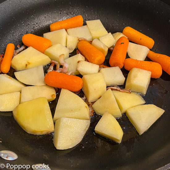 carrots and potatoes in the skillet